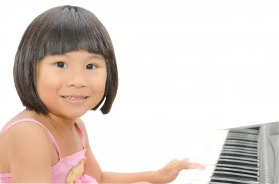 girl playing piano