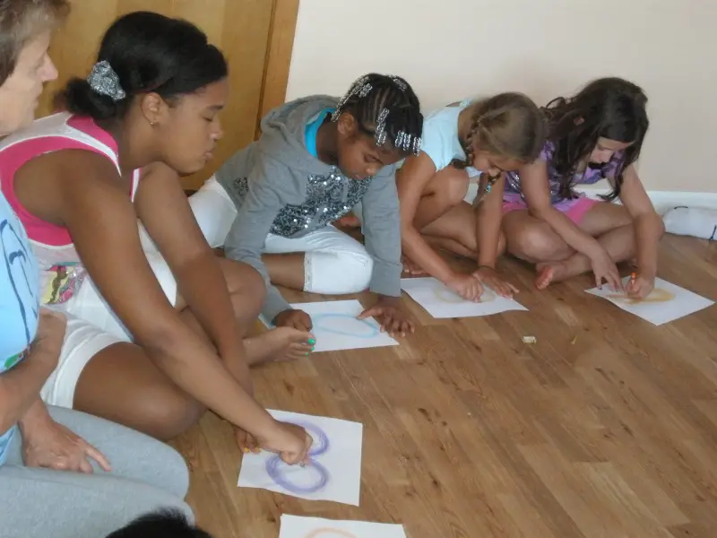 children drawing infinity signs at power brain training center
