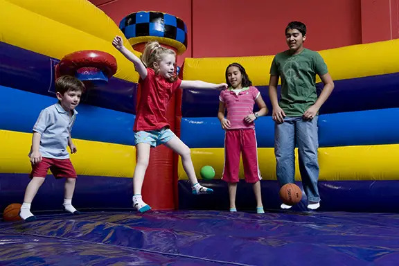 children bouncing at pump it up