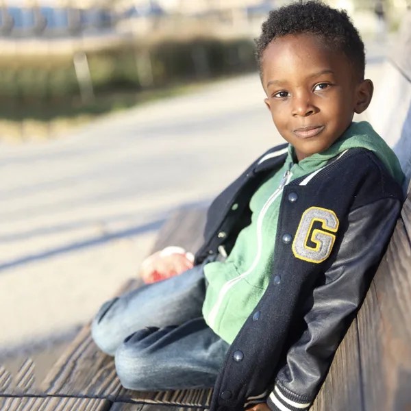 boy sitting on bench