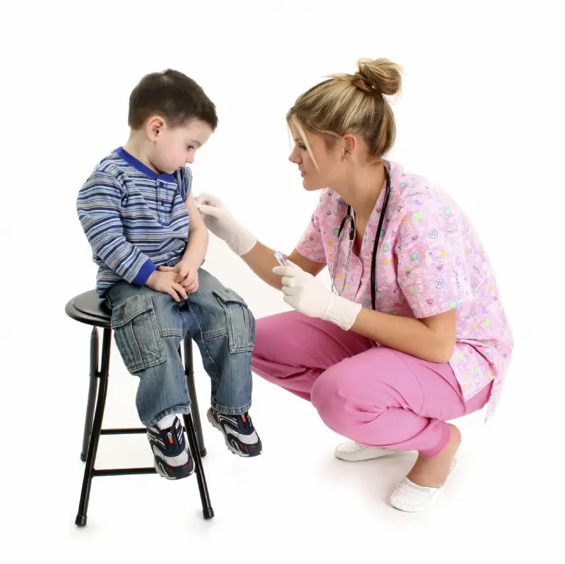 sad boy getting a shot at the doctor's office