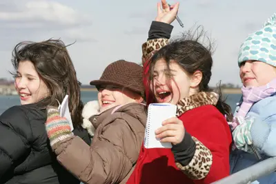 children on a winter seal cruise, long island; kids in a boat, on a winter cruise
