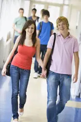 teen sweethearts; teen girl and boy holding hands; talking sex with kids