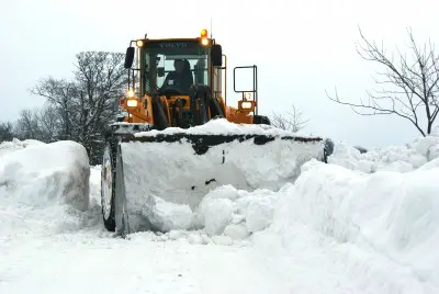 Truck Shoveling Snow