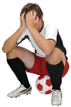boy soccer player, upset after losing a game
