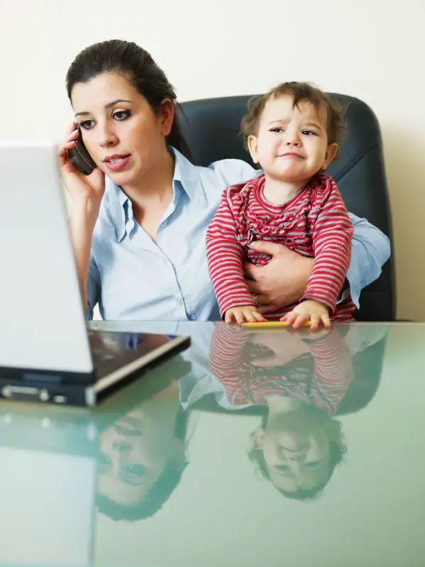 Stressed mom holding baby