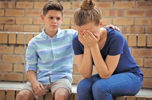 teen boy consoling friend