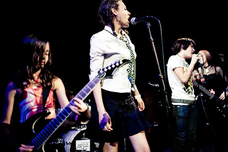 teen rock band performing