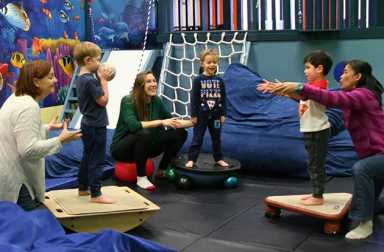 three-children-with-adults-therapy