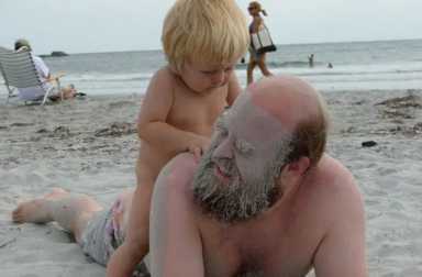tim-harrington-with-son-in-sand