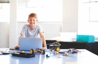 Portrait,Of,Male,Student,Building,And,Programing,Robot,Vehicle,In