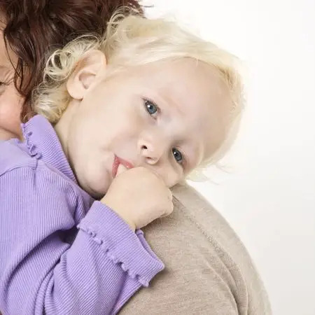 toddler sucking her thumb