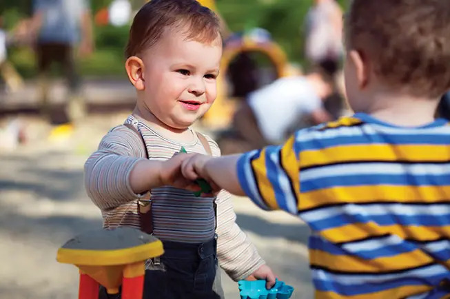 toddlers fighting over toy