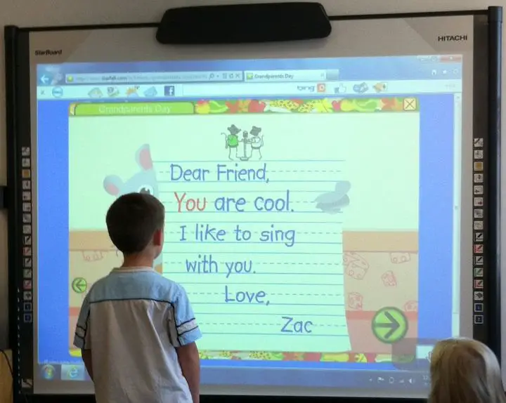 child using a smart board