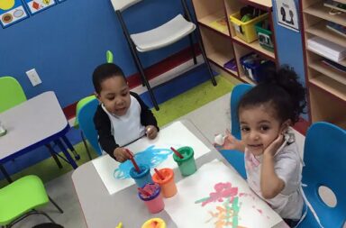 two-children-creating-art-at-tender-tots-child-care-center