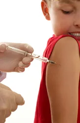 vaccines; child getting vaccine; little boy getting a shot; physicals for summer camp