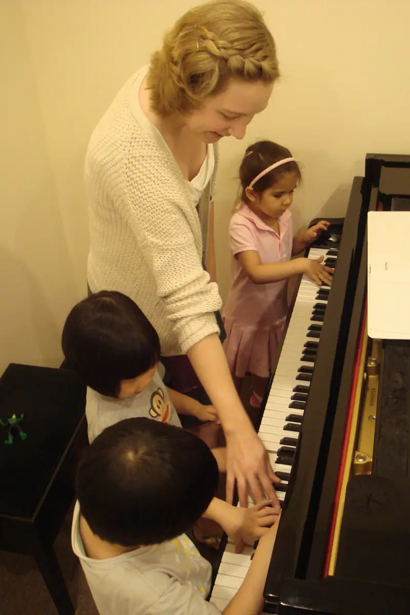vienna music teacher at piano with kids