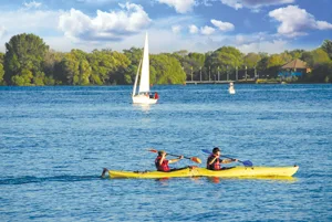 kayak on the water; two kayaks; lake; summer