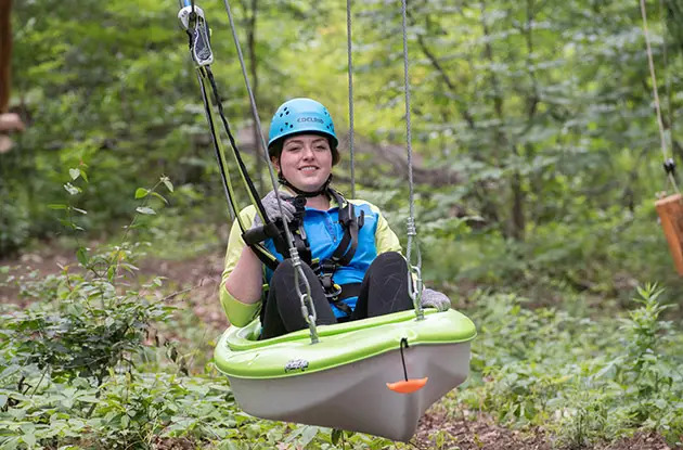 woman in kayak zip line