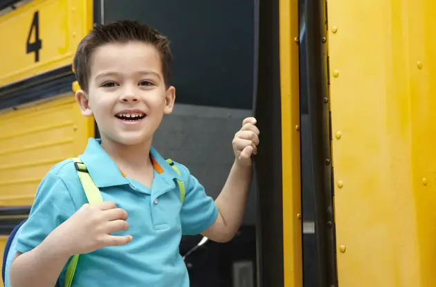 boy boarding a school bus