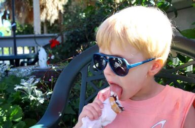 young-boy-eating-ice-cream-outside