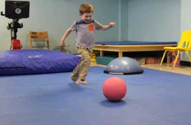 young-boy-kicking-ball