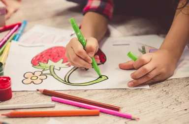 young-child-hands-coloring-strawberry