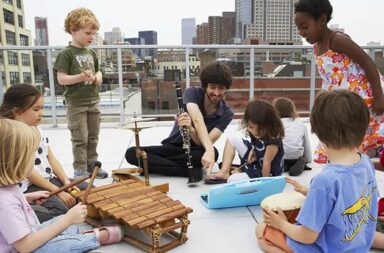young-children-outside-with-instruments