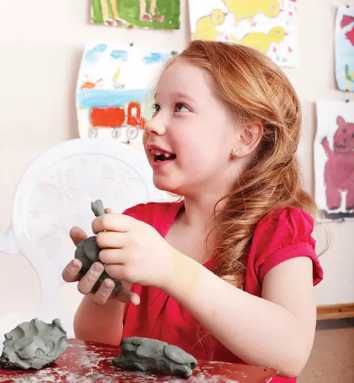 young-girl-sculpting-clay