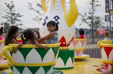 young-girls-on-teacup-ride-at-fair