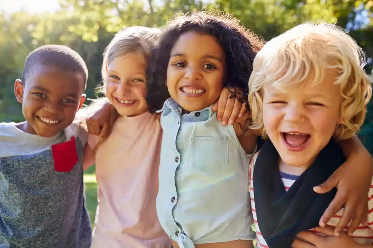 Four kids hanging out together in the garden