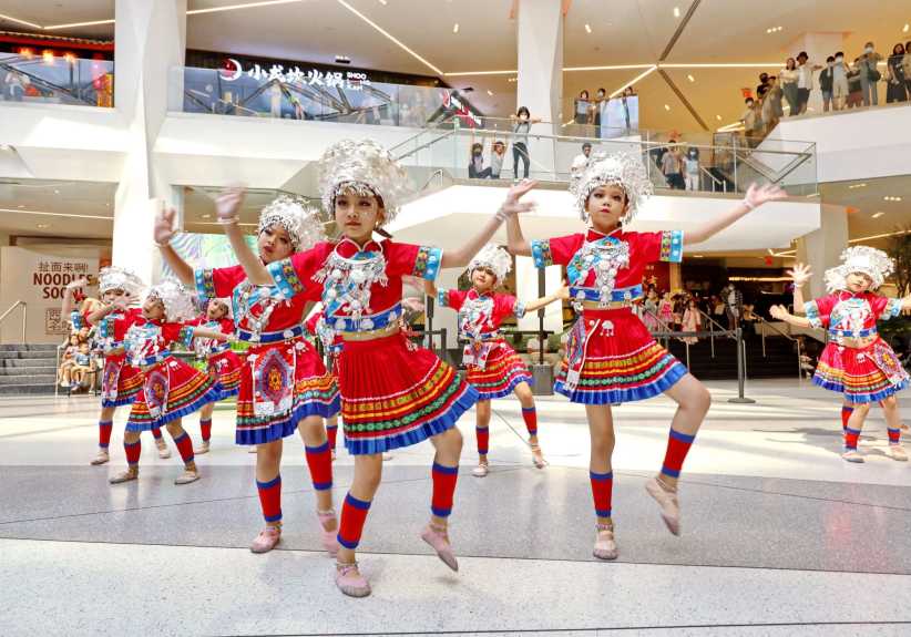 Children dancing in costumes. 