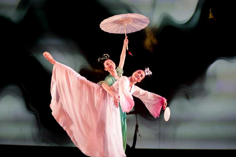 Two dancers performing on stage.