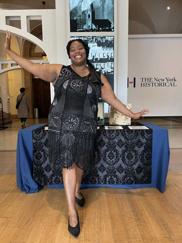Woman dressed in flapper style dress portraying Ma Rainey