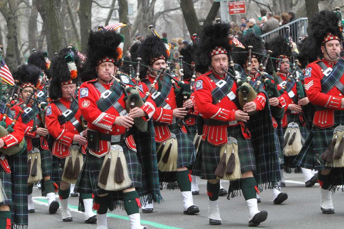 Bagpipers marching in a parade.