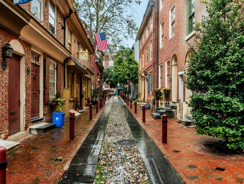 Philadelphia, PA US Oct 14, 2023 Horizontal view of Elfreth's Alley, a historic street in the Old City neighborhood of Philadelphia, Pennsylvania, dating to 1703. 5 Family Getaways from NYC You Can Do Without a Car