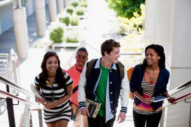 Students climbing steps together