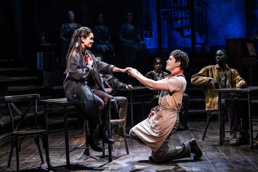 Young female and make actor on stage at Hadestown on Broadway Week
