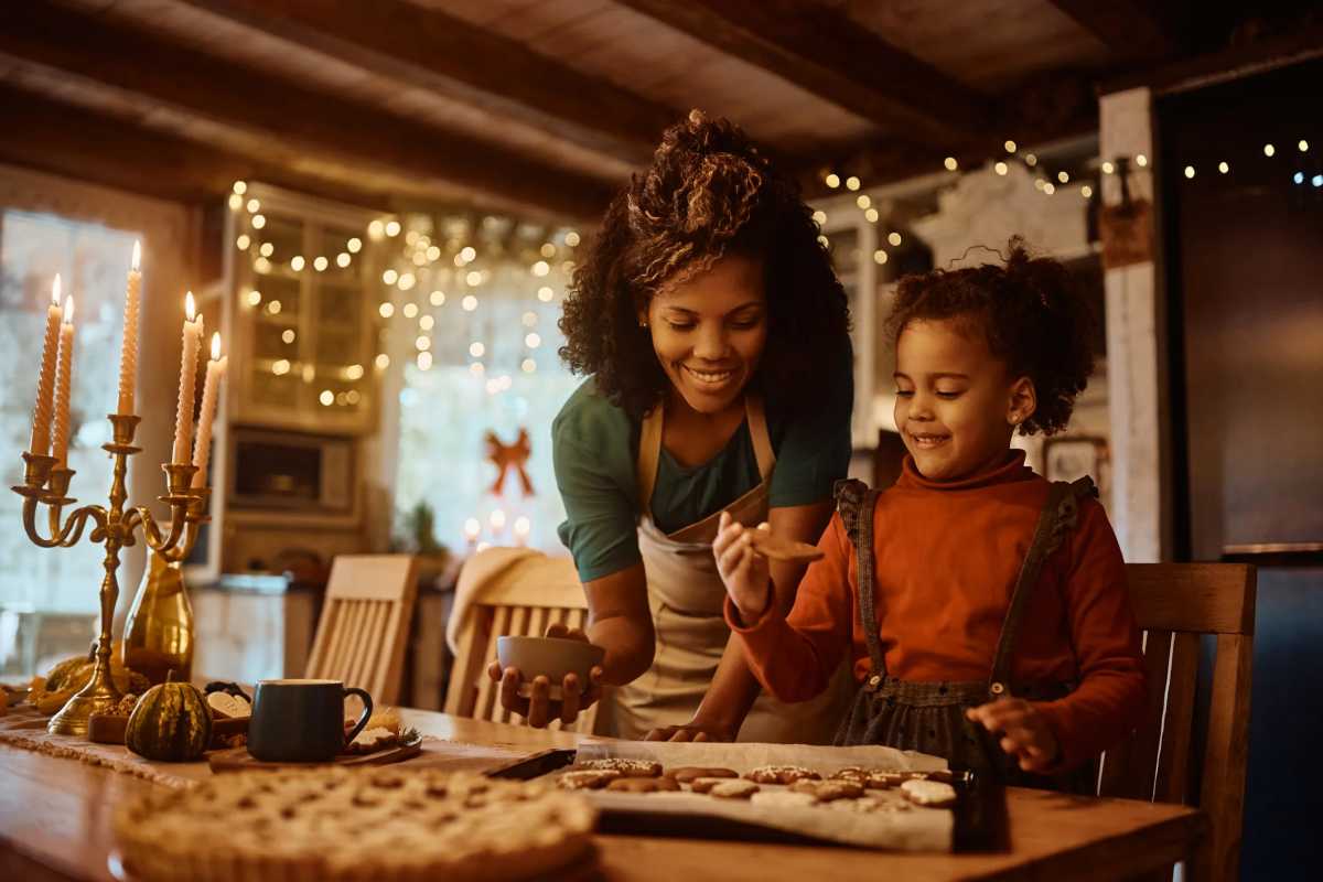 mother with her daughter in the kitchen during teh holidays