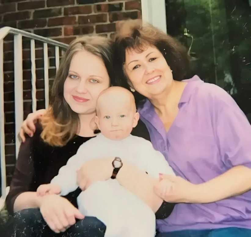 Mom and me sitting on her front porch with my son on my lap