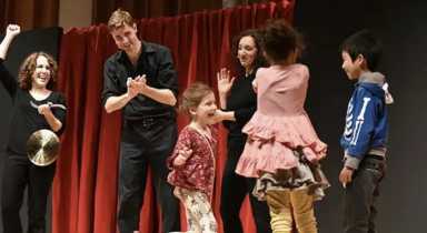 Kid and adult actors on stage performing for Broadway Playhouse in New York City, one of the things to do with kids in NYC this weekend