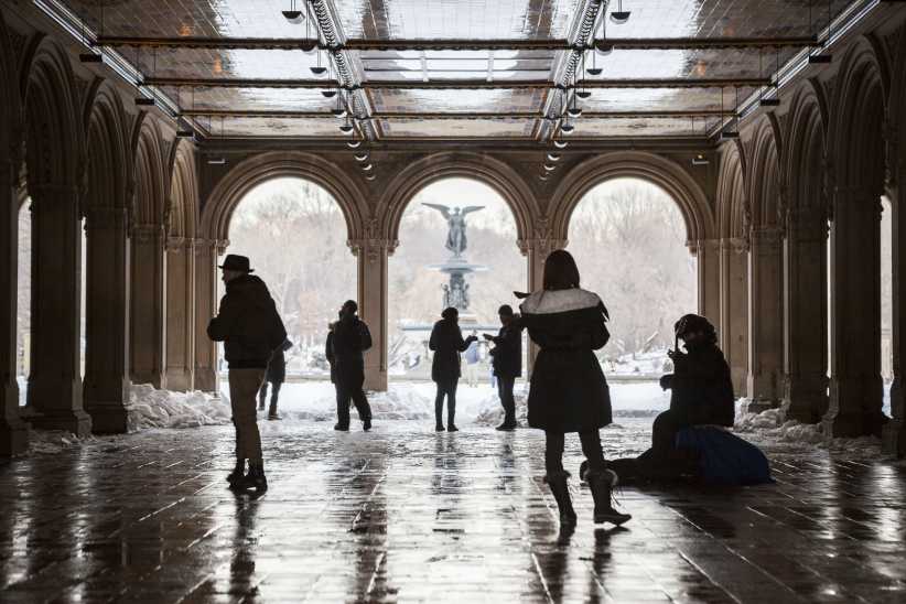 People walking through Central Park by the Bethesda Fountain, NYC Winter Outing