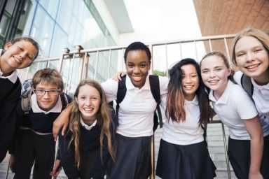 Group of catholic School students huddle together