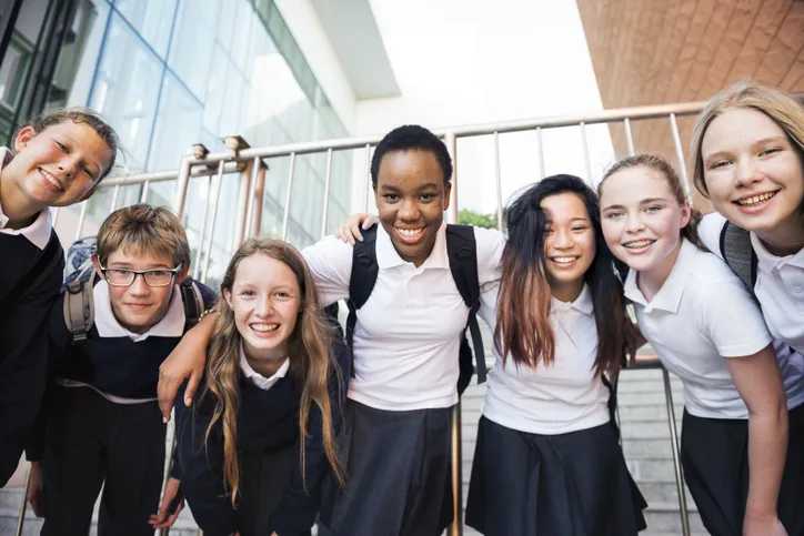 Group of catholic School students huddle together