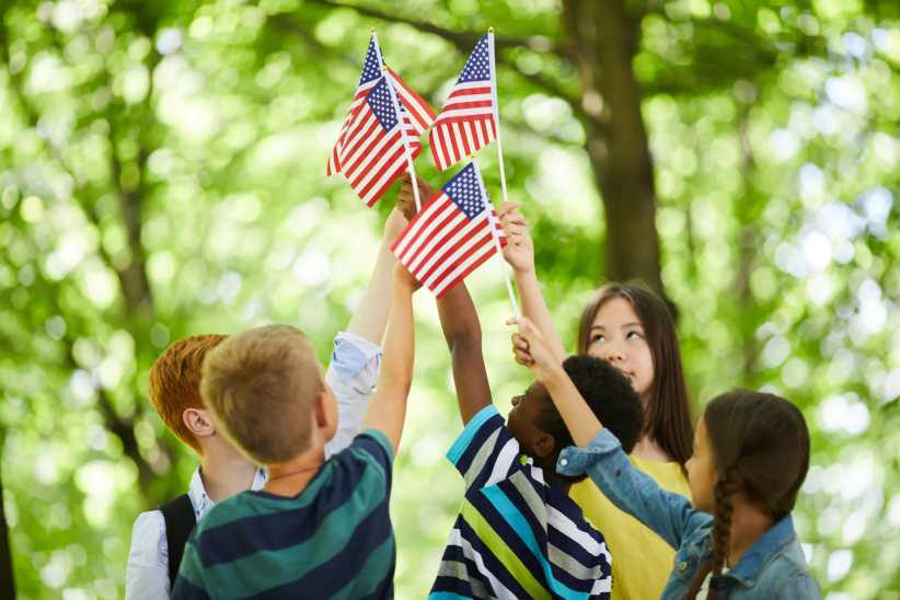Long Island 250 Events across Suffolk County, Long Island, to celebrate America 250. Kids celebrating with flags.