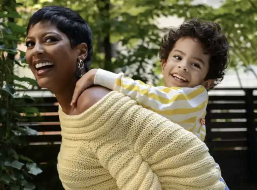 Tamron Hall, carrying her son Moses on her back, recalls the women who supported her, leading to the NAACP nomination