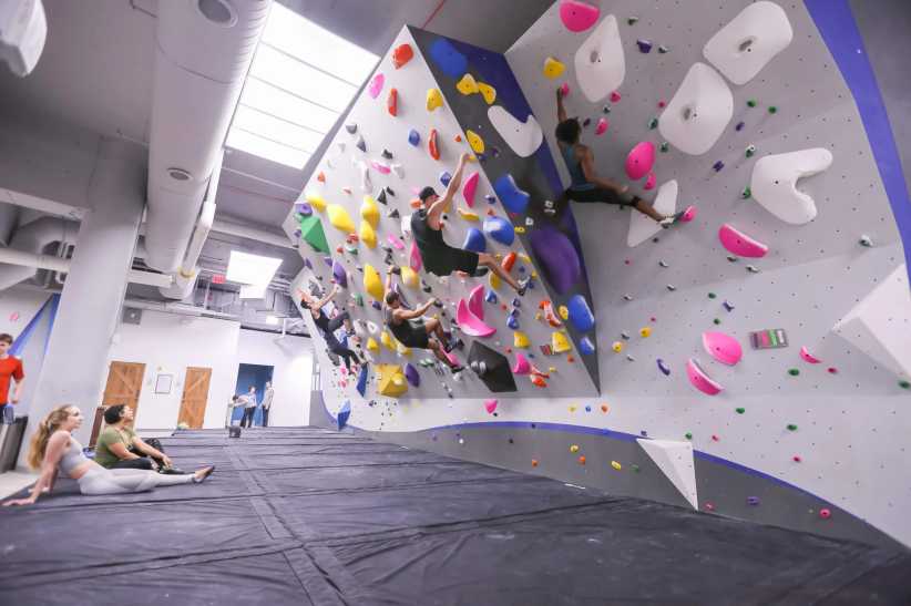 Indoor bouldering area with colorful overhang wall at Central Rock Gym Manhattan