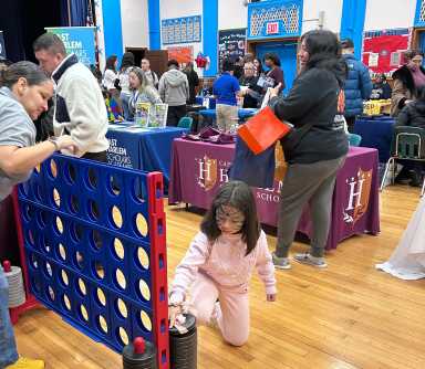 girl playing at the Harlem Charter School Fair