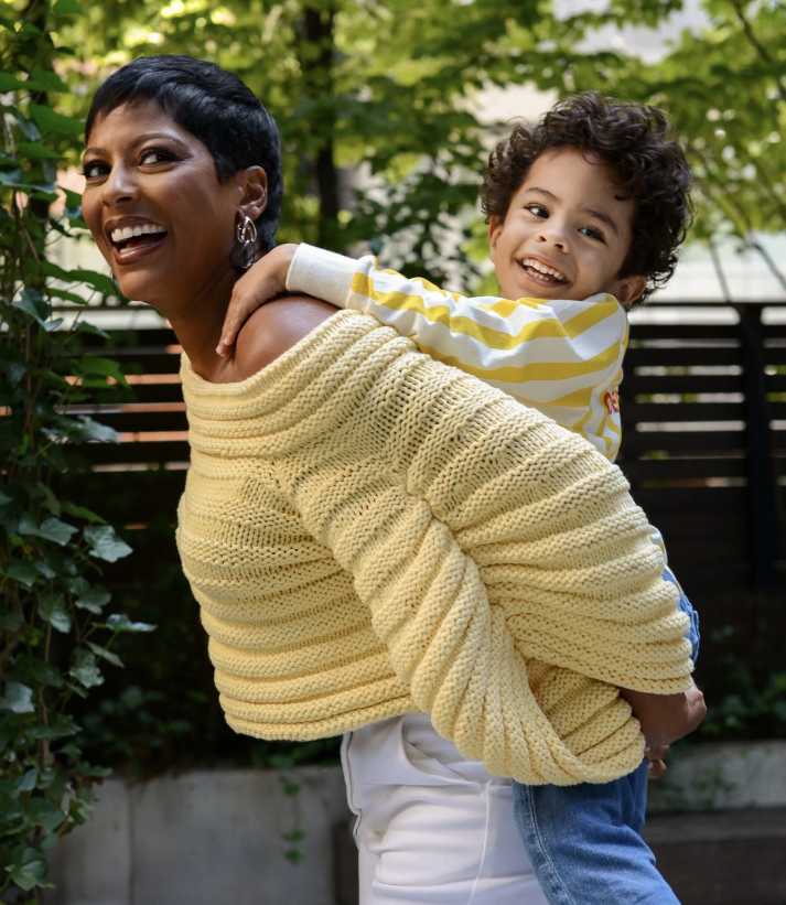 Tamron Hall, carrying her son Moses on her back, recalls the women who supported her, leading to the NAACP nomination