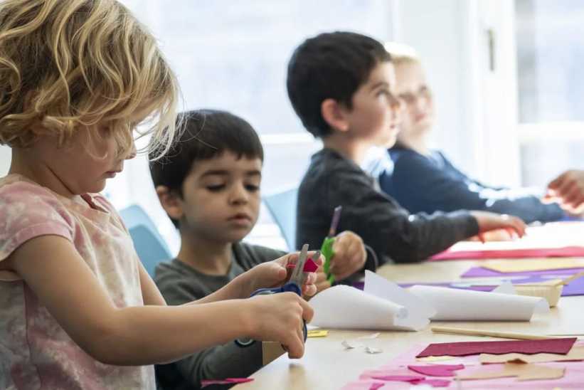 Kids at a table participating in craft projects